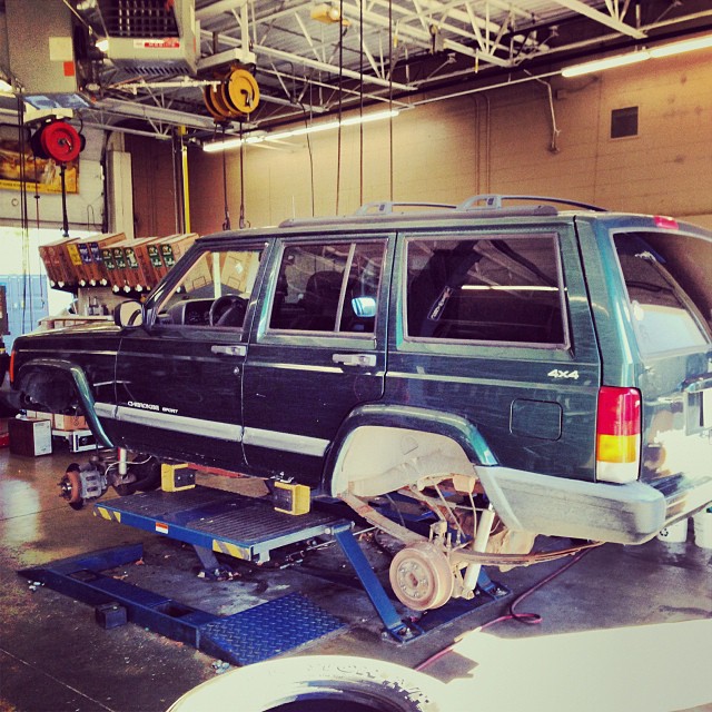 Getting new shoes on the Jeep...